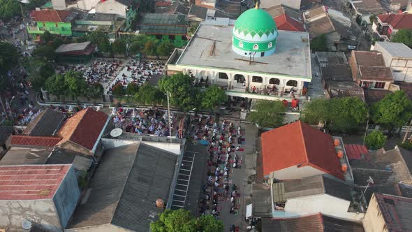 Aerial View of People offering prayers on the Eid morning at famous mosque Jama Masjid in Bekasi.