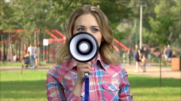 Smiling Woman Making Advertise with Megaphone