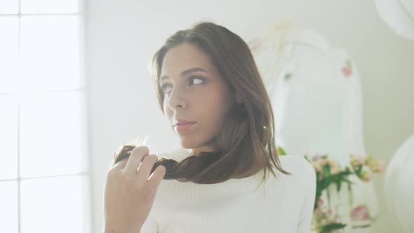 Young Beautiful Girl in White Decor