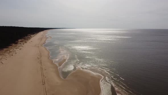 Sea shore aerial drone flyover