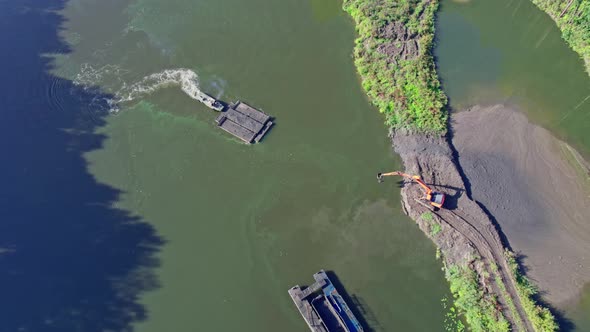 A Dredger Lifts Sand From the Bottom of the River