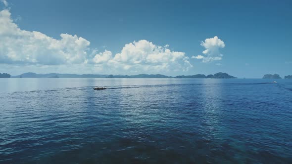 Aerial Blue Seascape with Sail Boat at Serene Waterfront