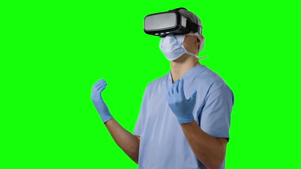 Young surgeon in scrubs and VR headset