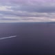 Boat travelling across the ocean on a cloudy evening - VideoHive Item for Sale