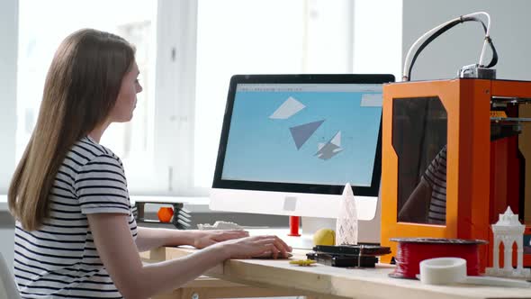 Woman Drawing 3D Model on Computer