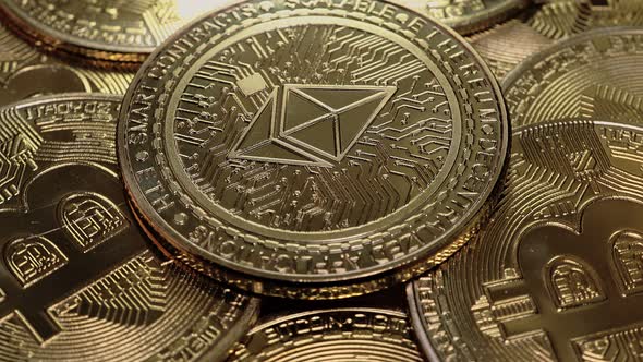 ETH, Ethereum coin on bitcoins background, cryptocurrency investing concept.