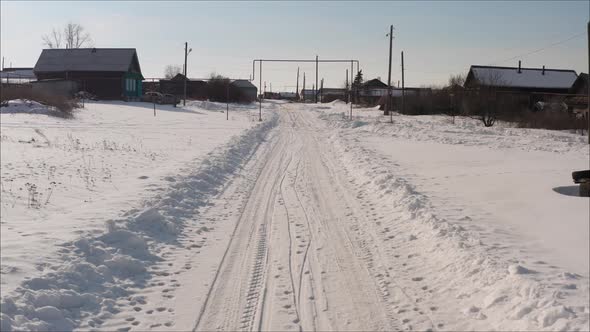 Russian Road in the Winter. Winter Road in the Village. Winter Landscape in the Village Shot From a