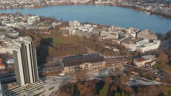 Wide Aerial View of a Train Arriving at Dammtor Train Station in Hamburg City Center