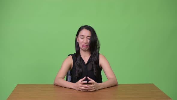 Young Beautiful Asian Businesswoman As Newscaster