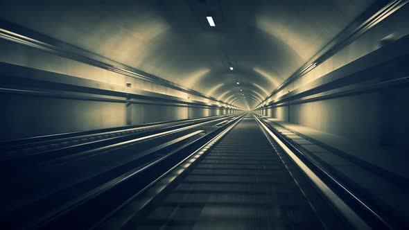 Seamless subway journey through the modern underground empty railway tunnel.