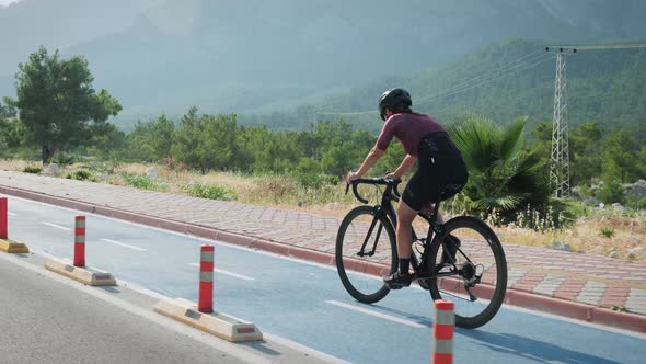 Female cyclist on bicycle lane