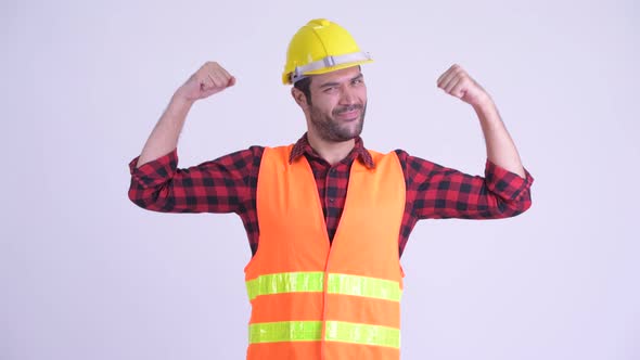 Happy Bearded Persian Man Construction Worker Flexing Both Arms