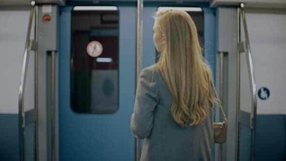 Blonde Business Girl Goes Into Modern Train Meets Her Friend