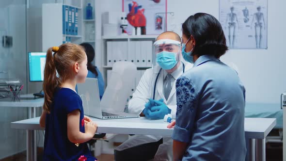 Medical Specialist Examining Child Xray