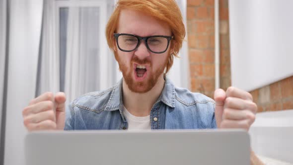 Angry Frustrated Redhead Beard Man Working on Laptop
