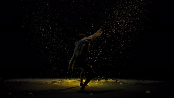 Emotional Performance of Contemporary Choreography or Modern Ballet. A Silhouette of a Man Against