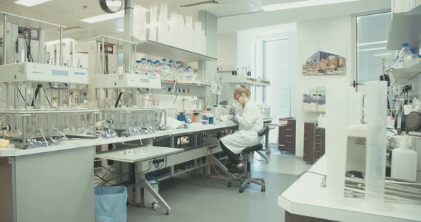 Scientist working in a pharmaceutical laboratory conducting experiments