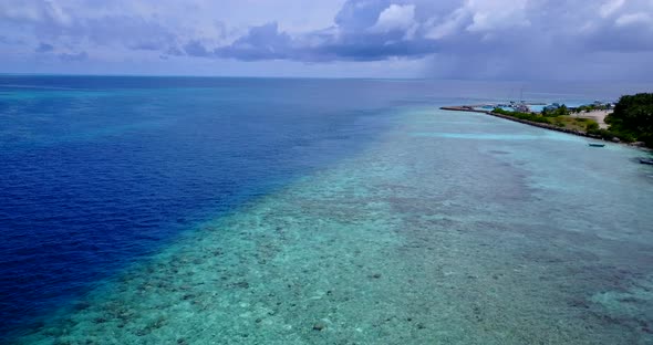 Natural above abstract shot of a white sand paradise beach and turquoise sea background in colorful 