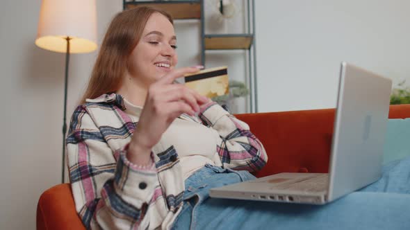 Woman Sitting at Home Using Credit Bank Card and Laptop Pc While Transferring Money Online Shopping