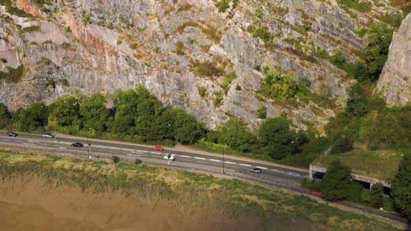 View down onto a road and cliff face by the river Avon