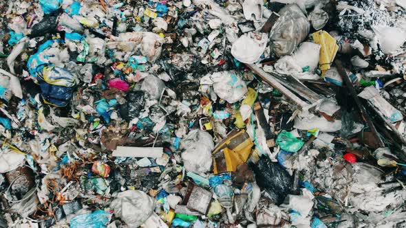 Zoom-out of an Outdoors Garbage Pile While Snowing