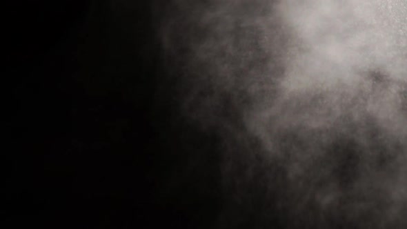 Smoke on black background in slow motion, steam mist on black background.
