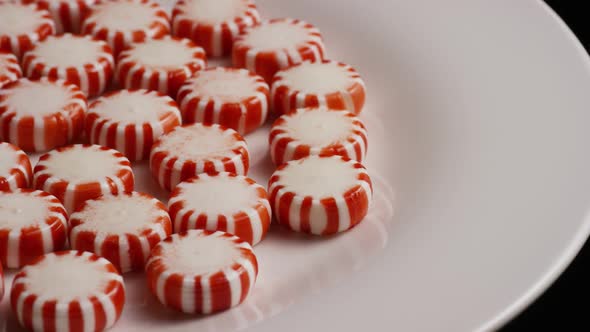 Rotating shot of peppermint candies - CANDY PEPPERMINT 034