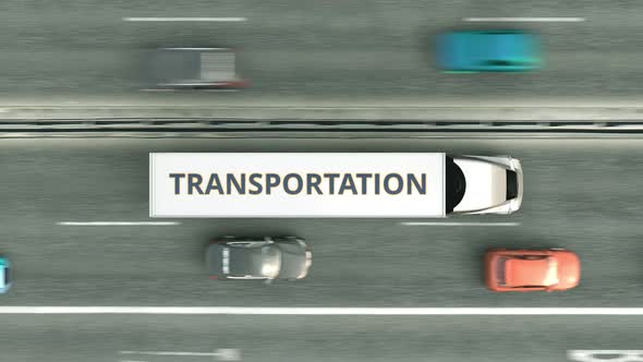 Trucks with TRANSPORTATION Text Driving Along the Highway