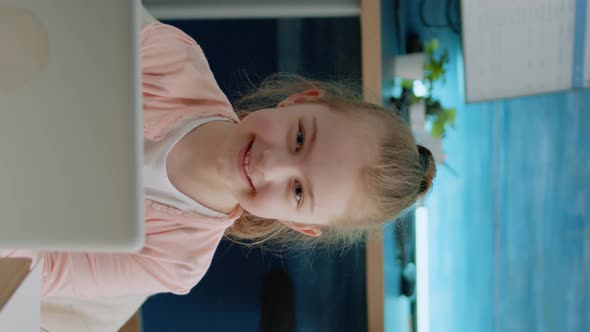 Vertical Video Portrait of Young Girl Smiling and Holding Laptop at Home