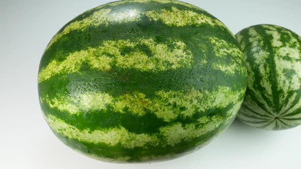 Two Watermelons On A White Surface