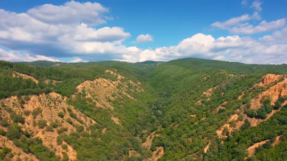 The Drone Flies Over Red Rocks On A Sunny Day With A Clear Blue Sky In National Park