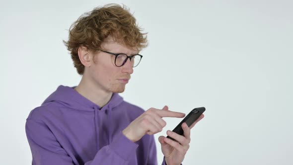 Redhead Young Man Browsing Smartphone White Background