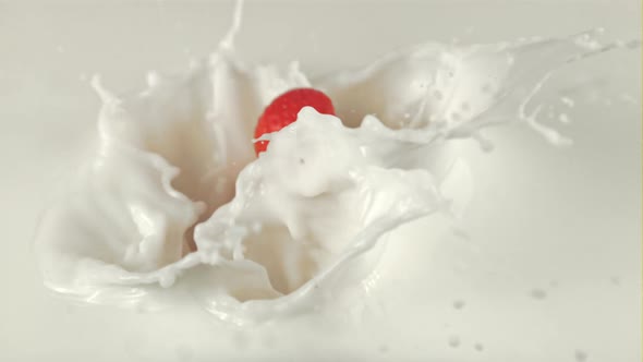 Super Slow Motion with Splashes Falls Into the Milk of Fresh Strawberries