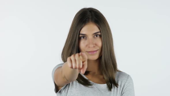 Pointing Finger of Girl toward Camera, White Background in Studio