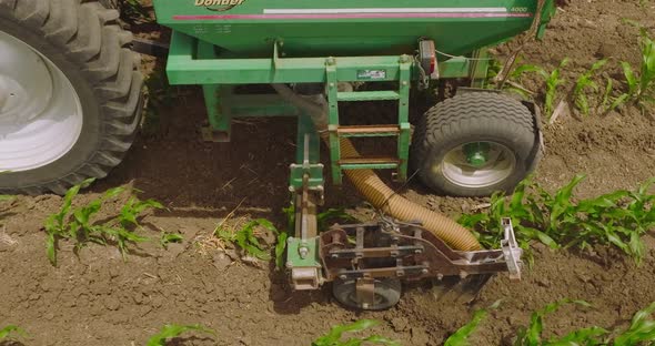 Tractor spreading fertilizer, Aerial closeup.