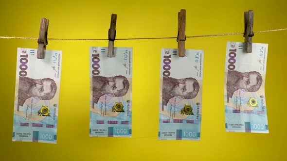 Ukrainian Currency is Dried on a Rope