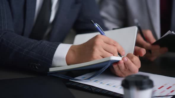 Lawyers Team Hands Writing Notes Filling Paperwork in Business Meeting Office