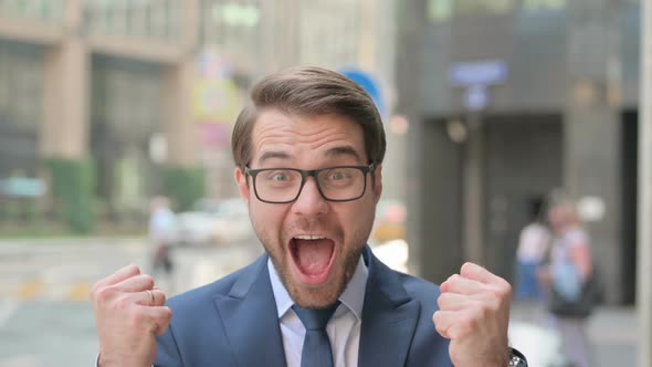 Portrait of Excited Businessman Celebrating Success