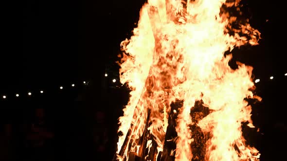 Big Bonfire Burns at Night in Slow Motion on a Black Background on Nature