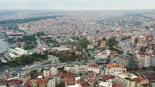 Aerial coastal view of Istanbul Turkey as cars and busses drive across the highway near the Bosphoru