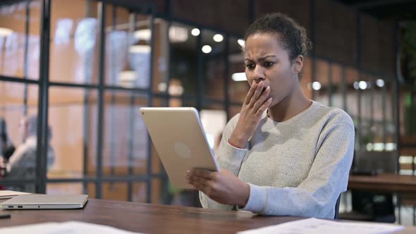 African Woman Upset By Loss on Tablet