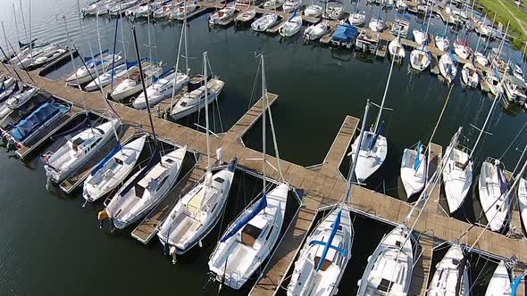 Aerial footage of sailboat marina.