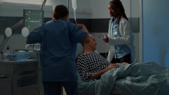 Nurse and African American Medic Using Oxygen Tube