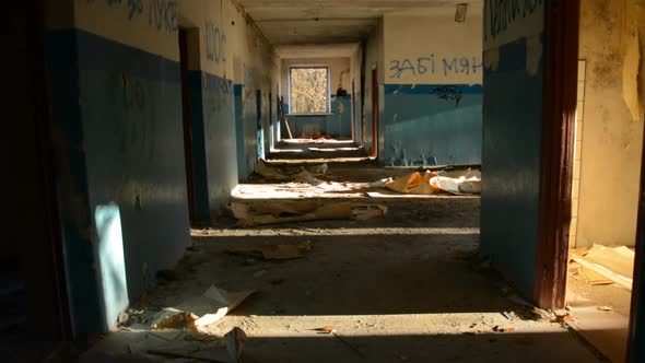 Abandoned Building Walking Down a Dark Corridor