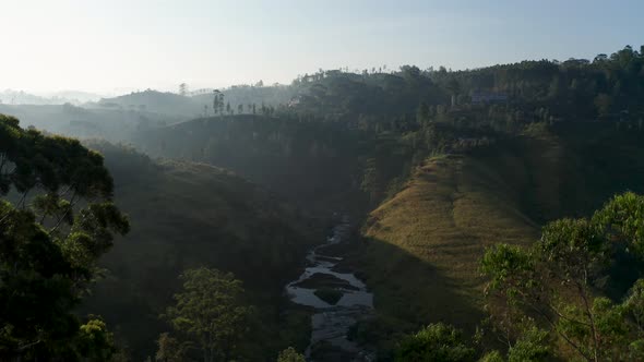 Aerial View of Tea Plantations, Fields, Waterfall During Sunrise. Sri Lanka Island