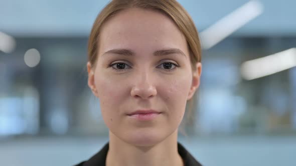 Face Close Up of Woman Looking at the Camera