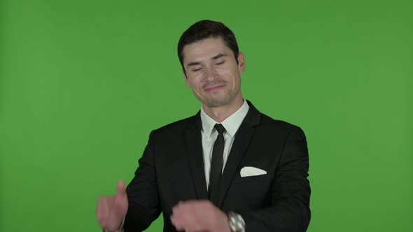 Cheerful Young Businessman Clapping Chroma Key