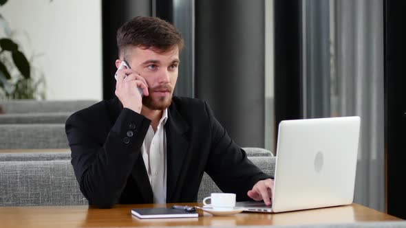 Office Worker To Make Calls at a Table in a Cafe