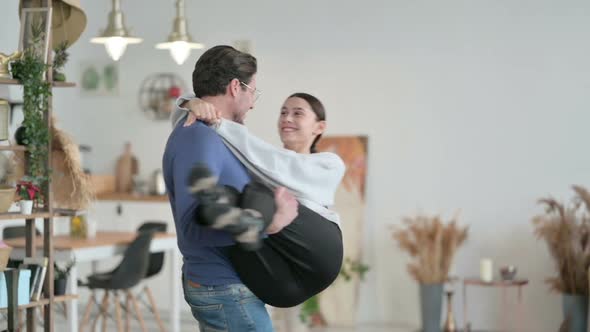 Slow Motion of Man Holding and Swinging Woman in His Arms