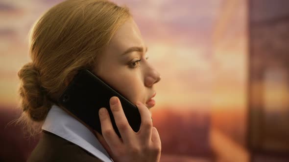 Lady Standing on Terrace of Office Center, Discussing Business Issues on Phone